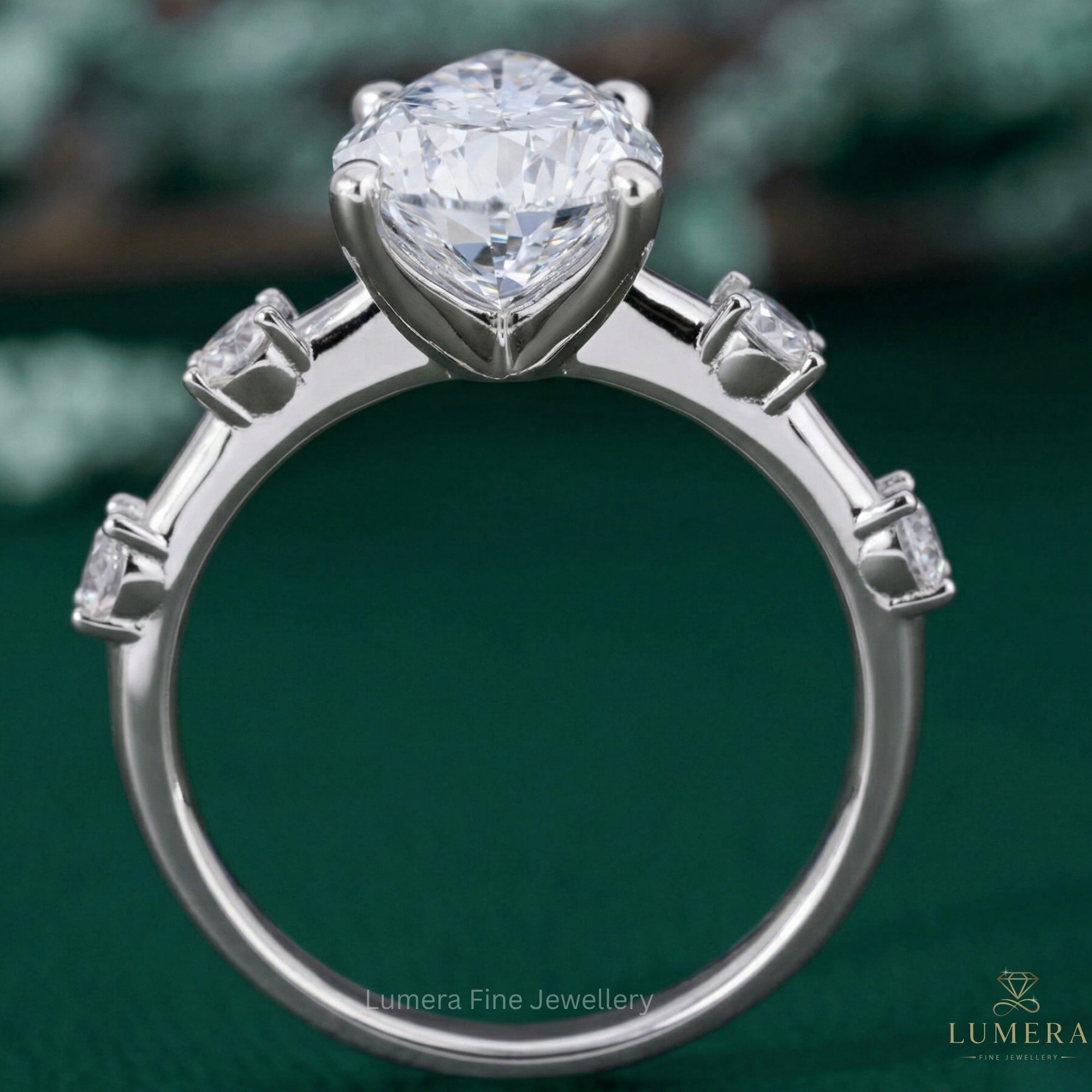 pear shaped halo engagement ring with almond engagement ring.