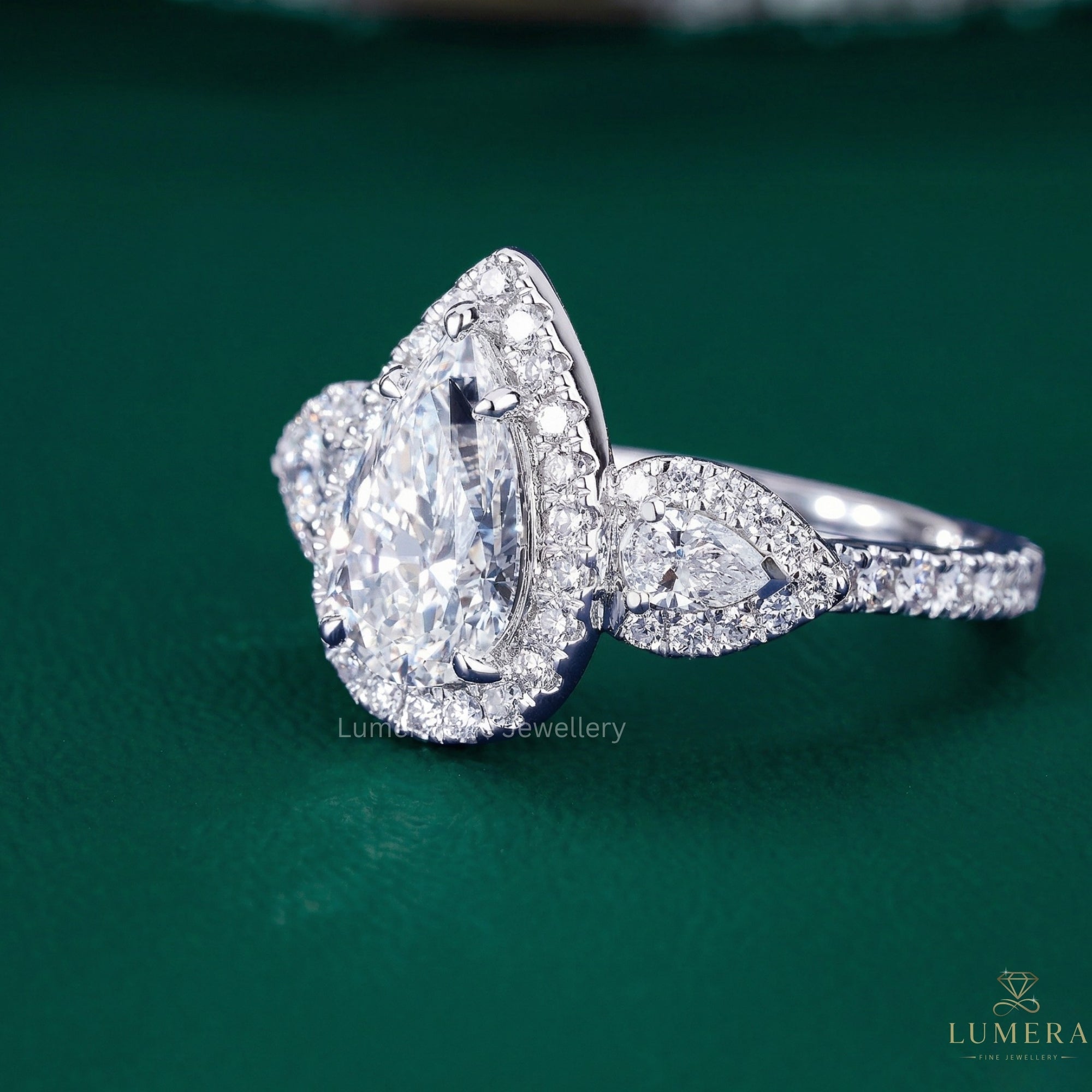 pear shaped diamond ring with almond engagement ring.