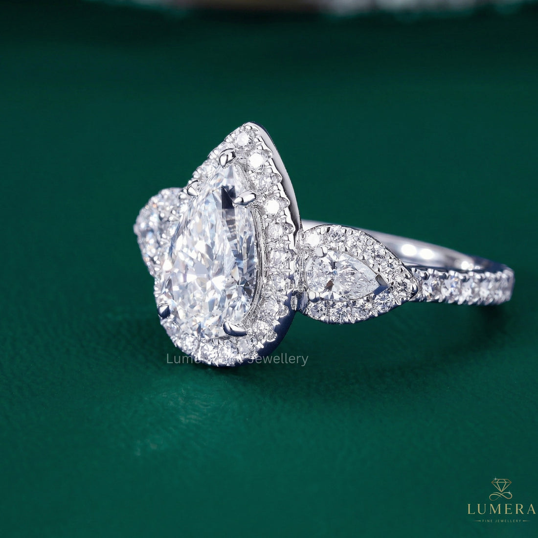 pear shaped diamond ring with almond engagement ring.