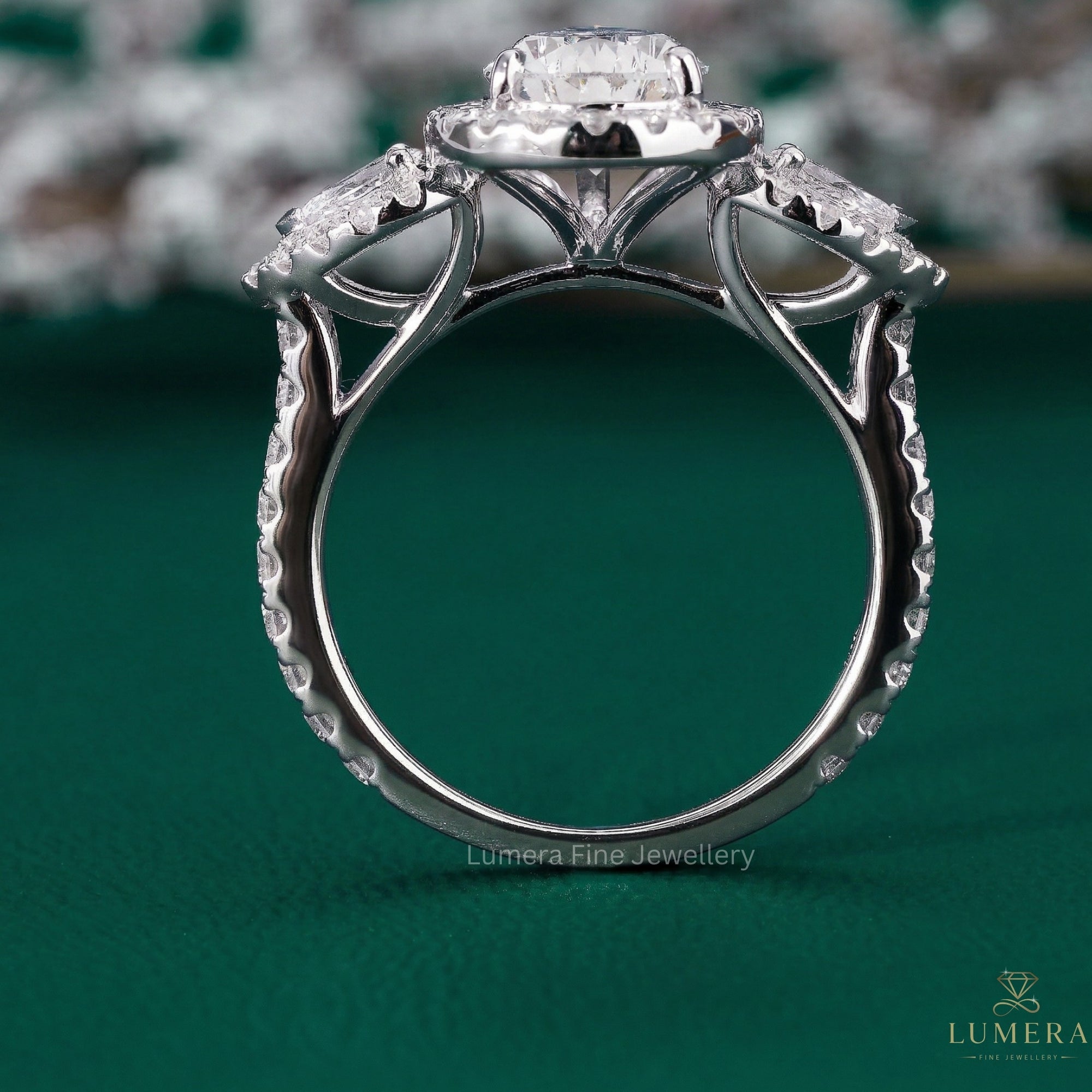 pear diamond ring with pear side stone.