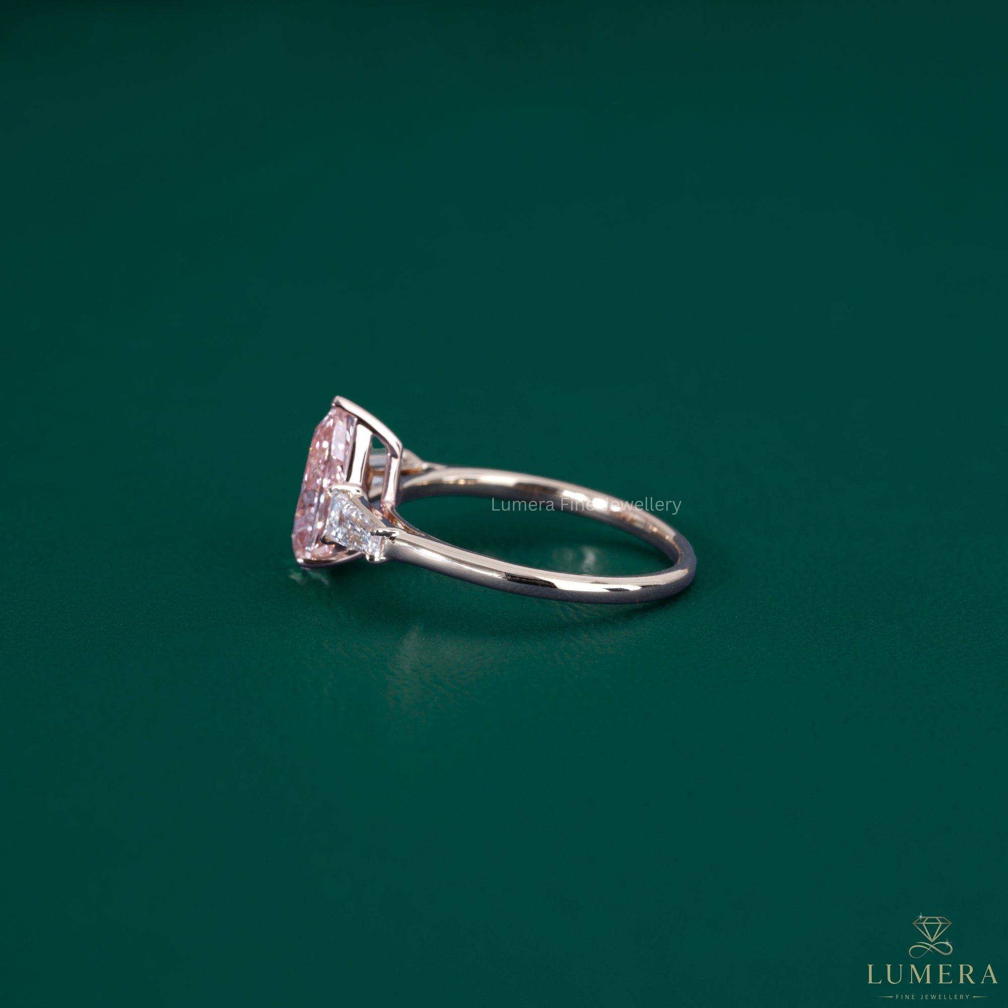 Pear shaped ring paired with a solid gold ring.