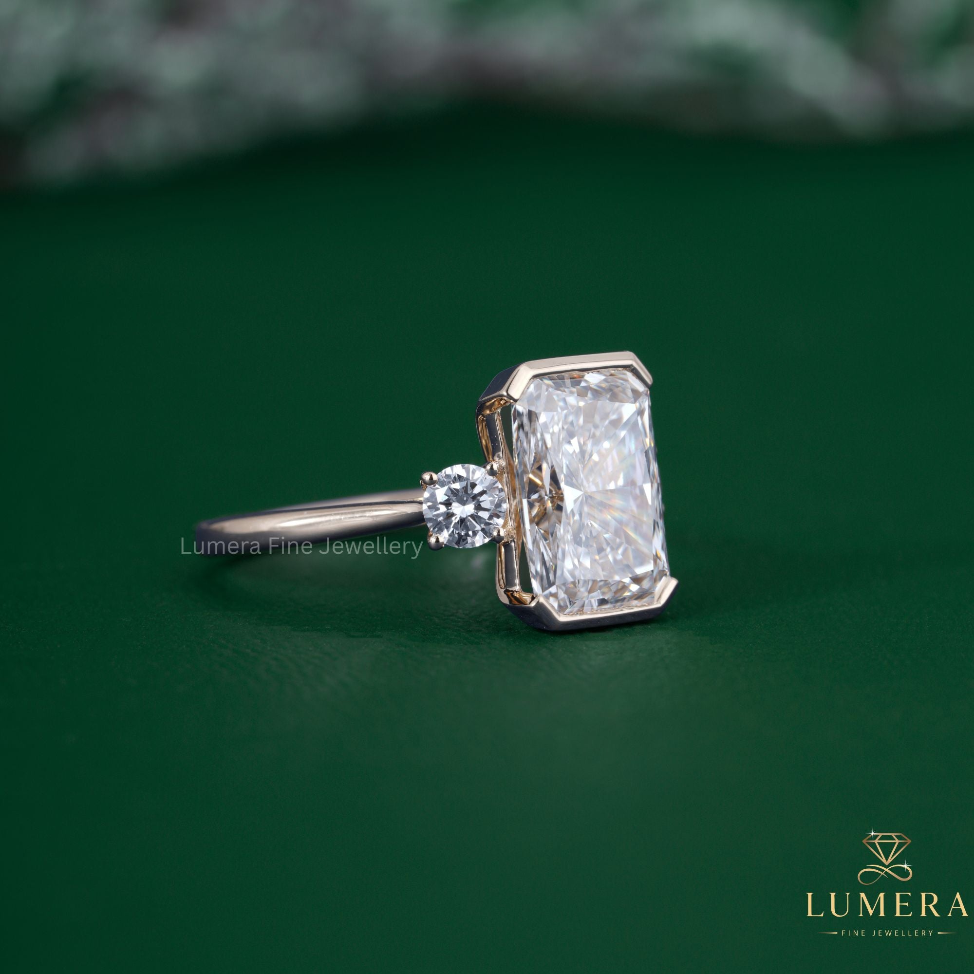 Radiant and round diamond ring with cathedral setting ring.