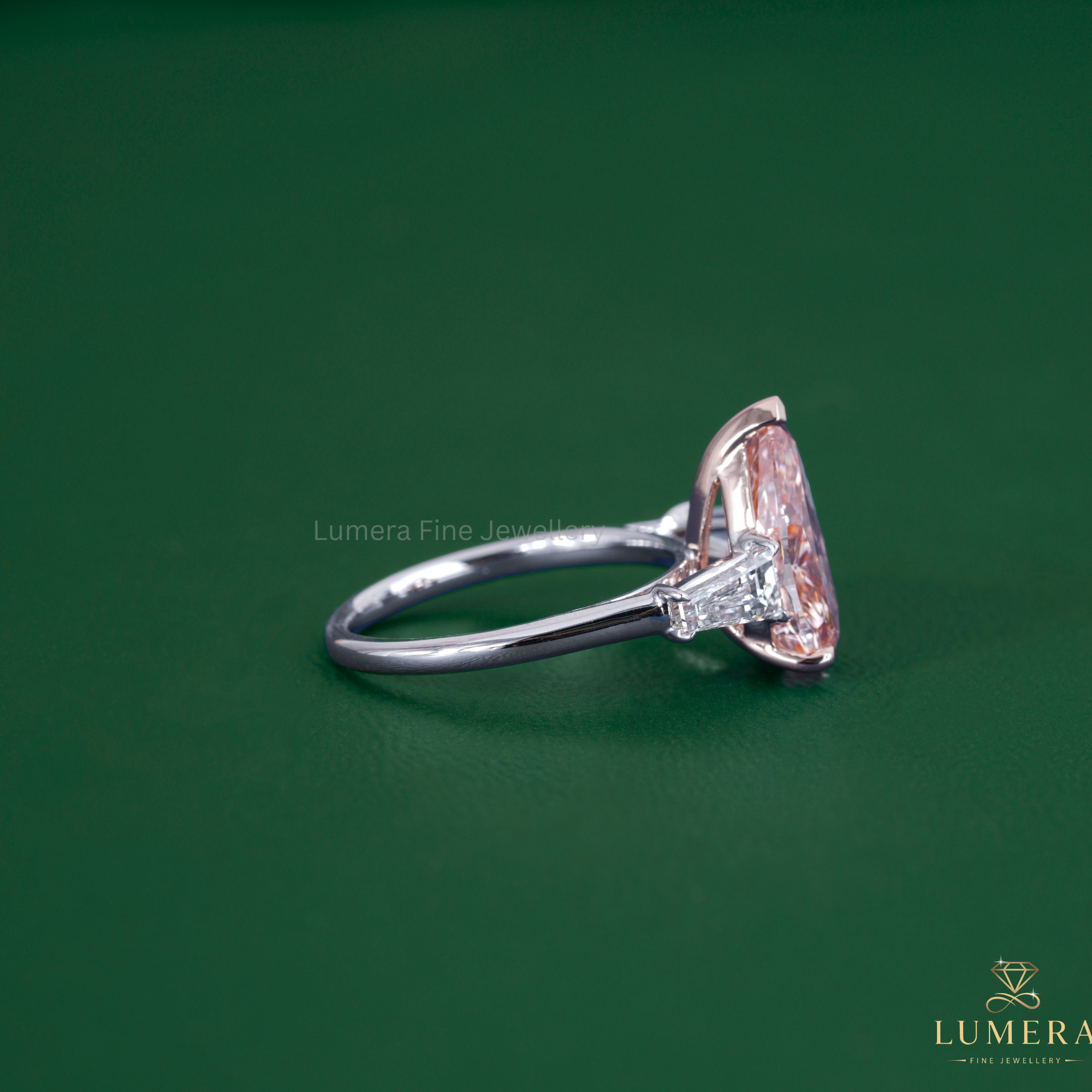 Pink stone ring featuring a color diamond ring.
