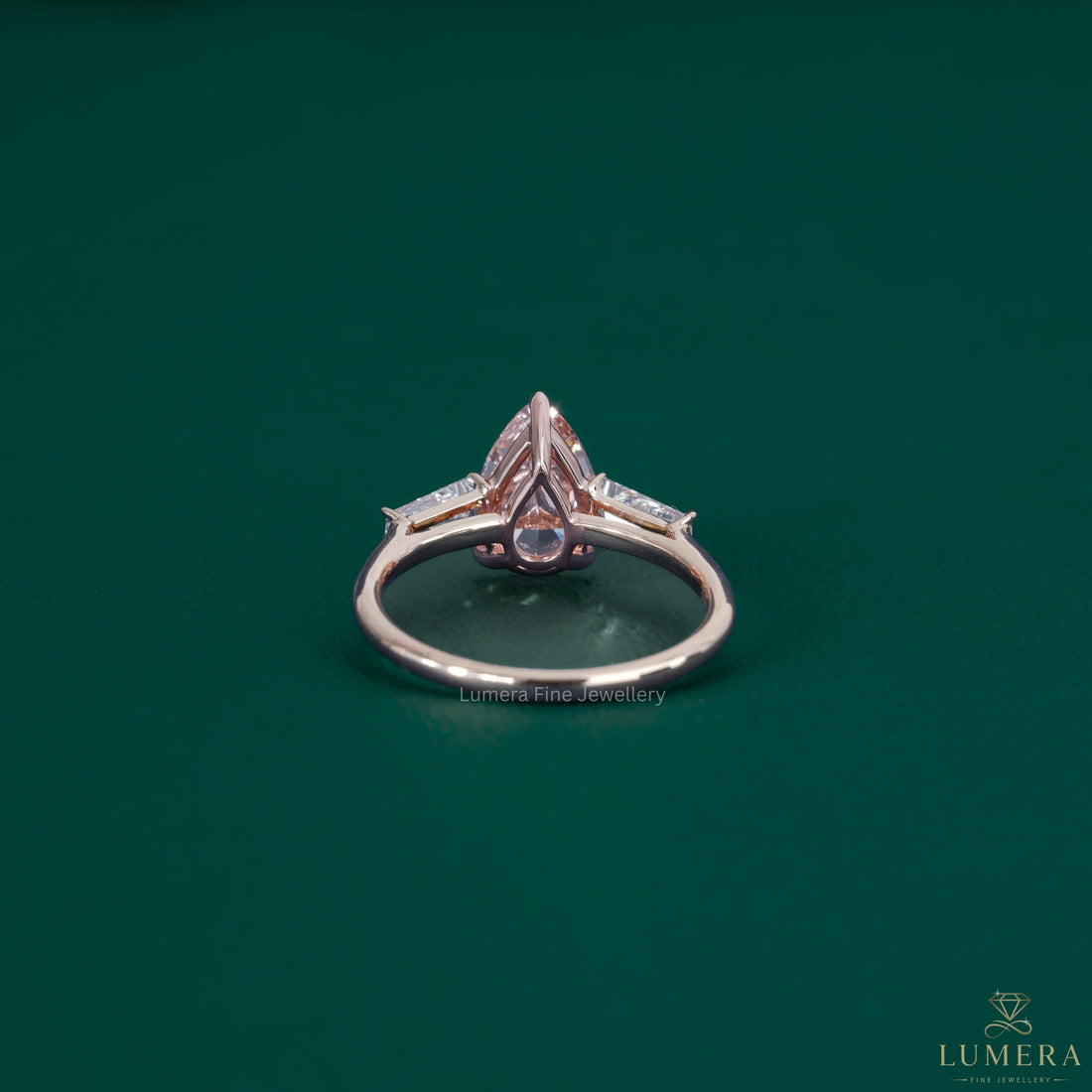 Almond diamond engagement ring featuring a color stone ring.