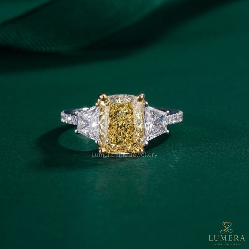 Cushion cut engagement ring with yellow diamond ring.

