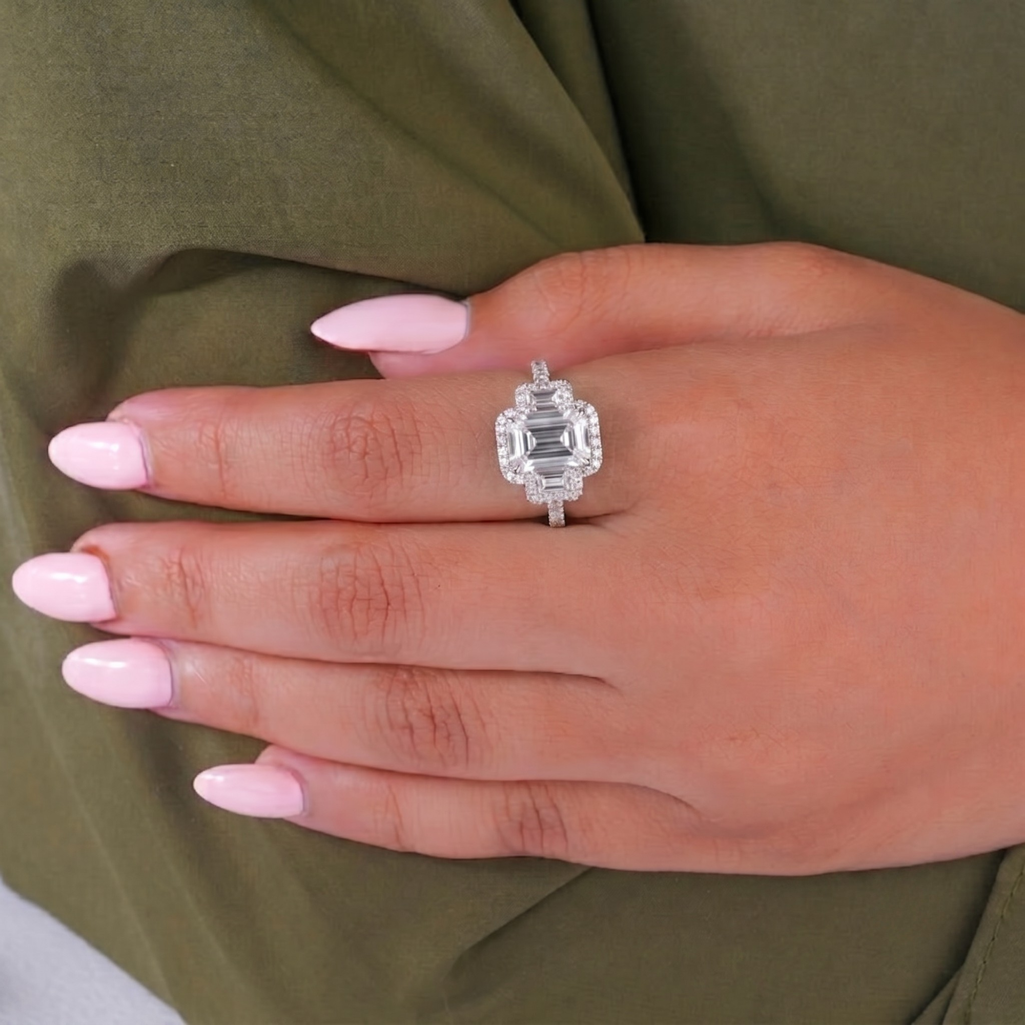 cathedral setting ring with emerald side stones.
