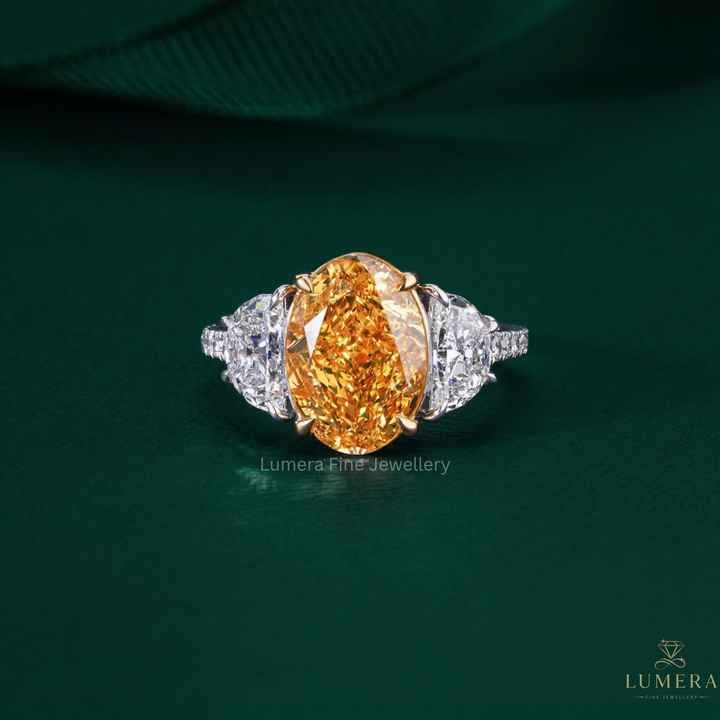 oval diamond engagement ring with yellow diamond ring.

