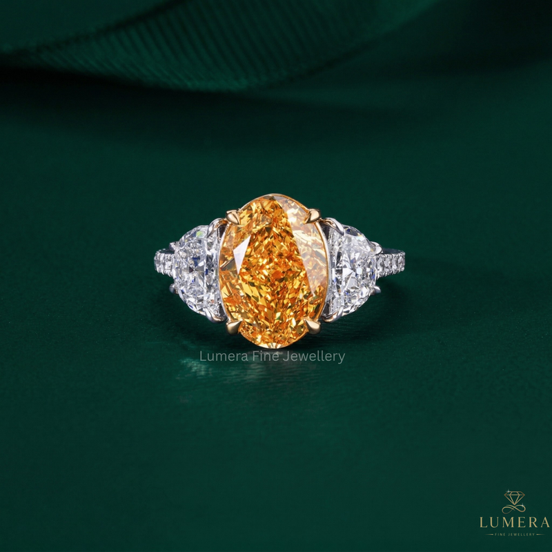 oval diamond engagement ring with yellow diamond ring.
