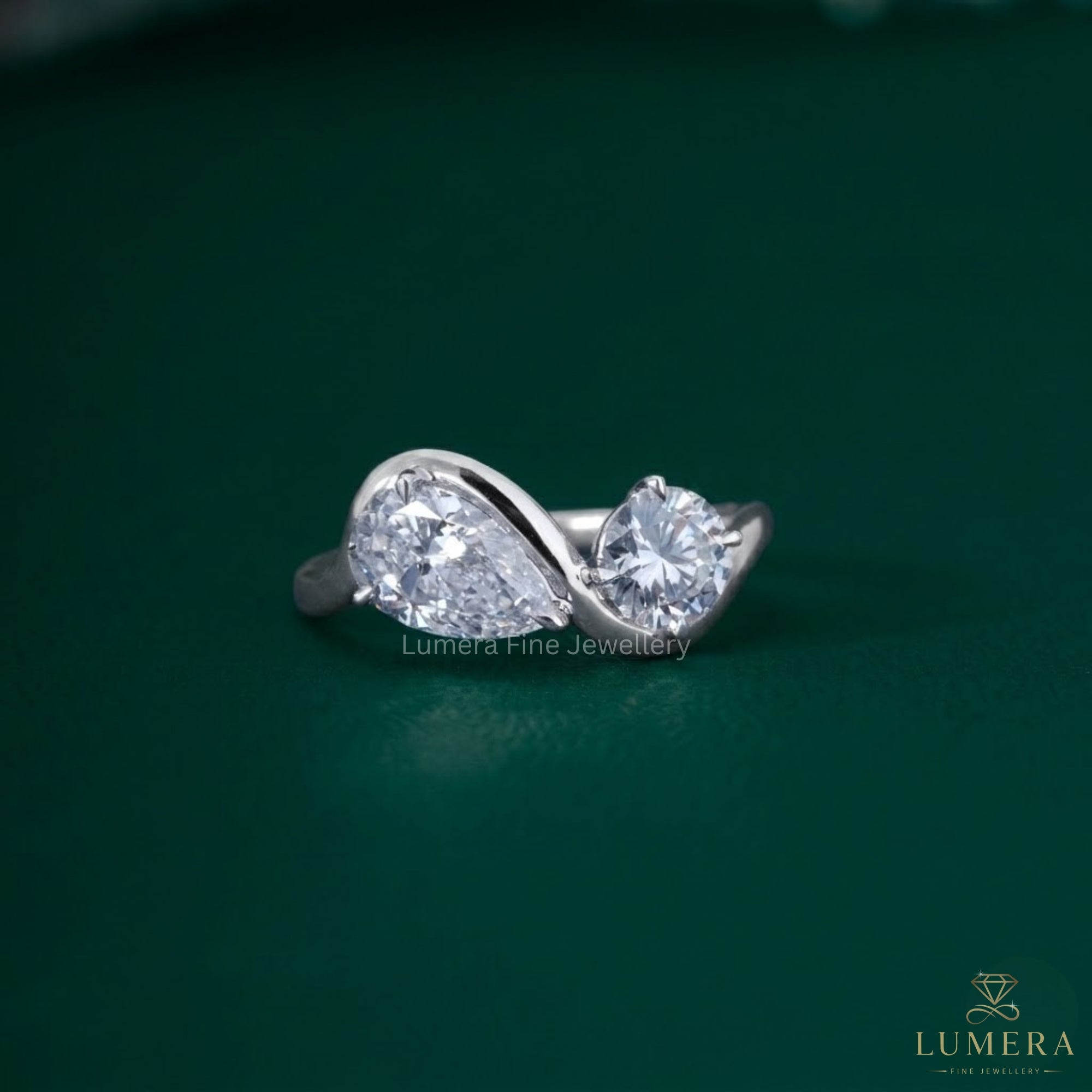Almond and round engagement ring with Bypass toi et moi ring.