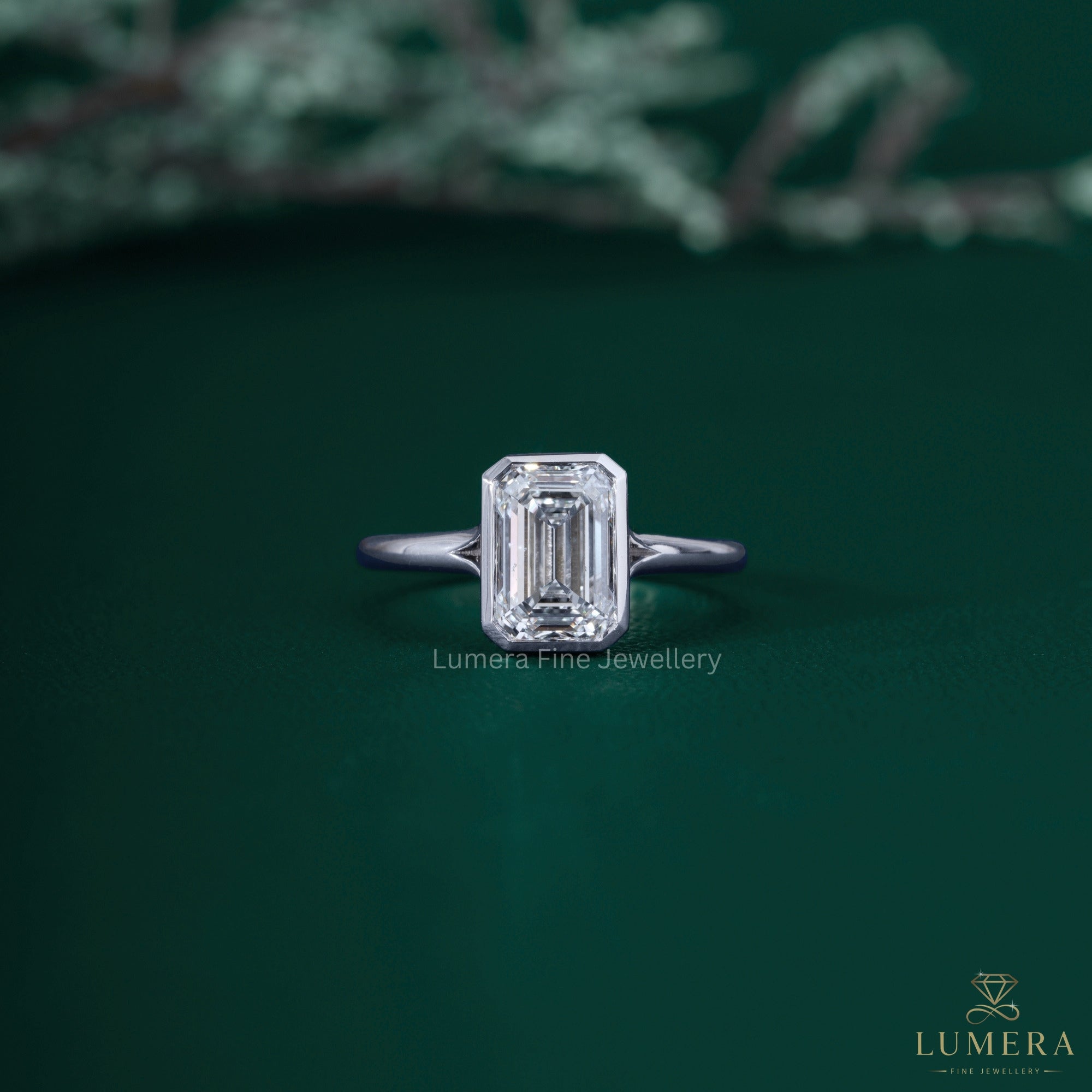 Emerald diamond solitaire ring with emerald cut ring.