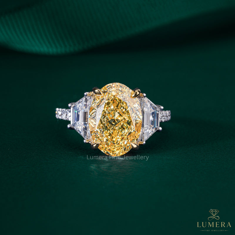 yellow diamond ring with yellow claw prong setting.
