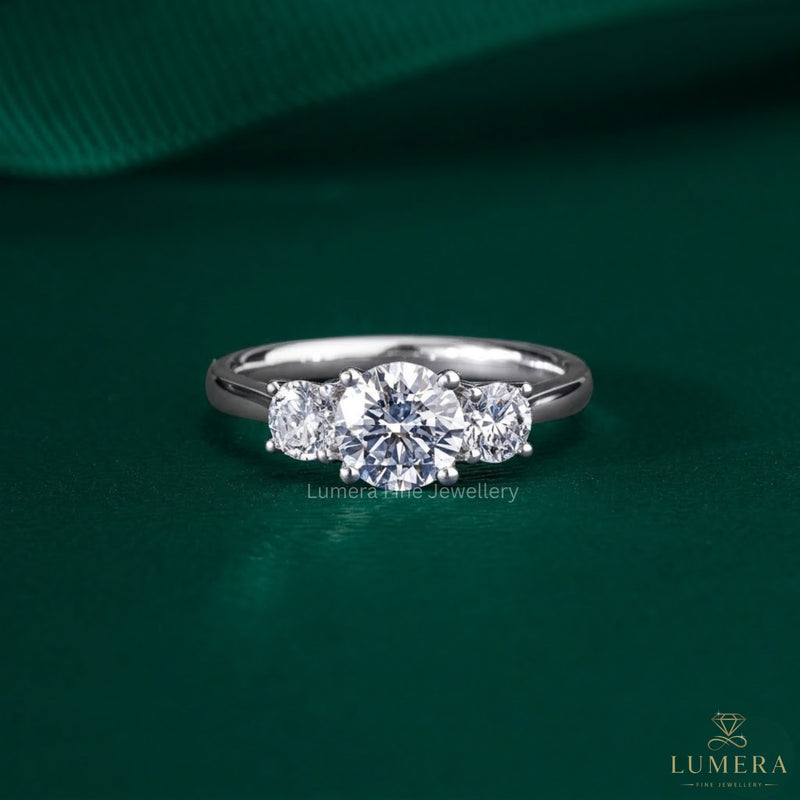 three stone engagement ring on solid gold ring.
