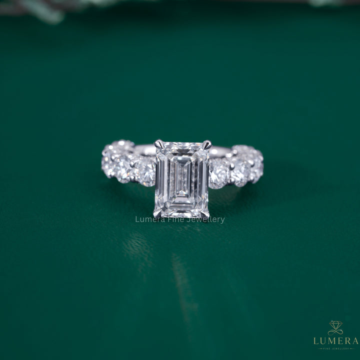 Hidden halo engagement ring with emerald diamond engagement ring.