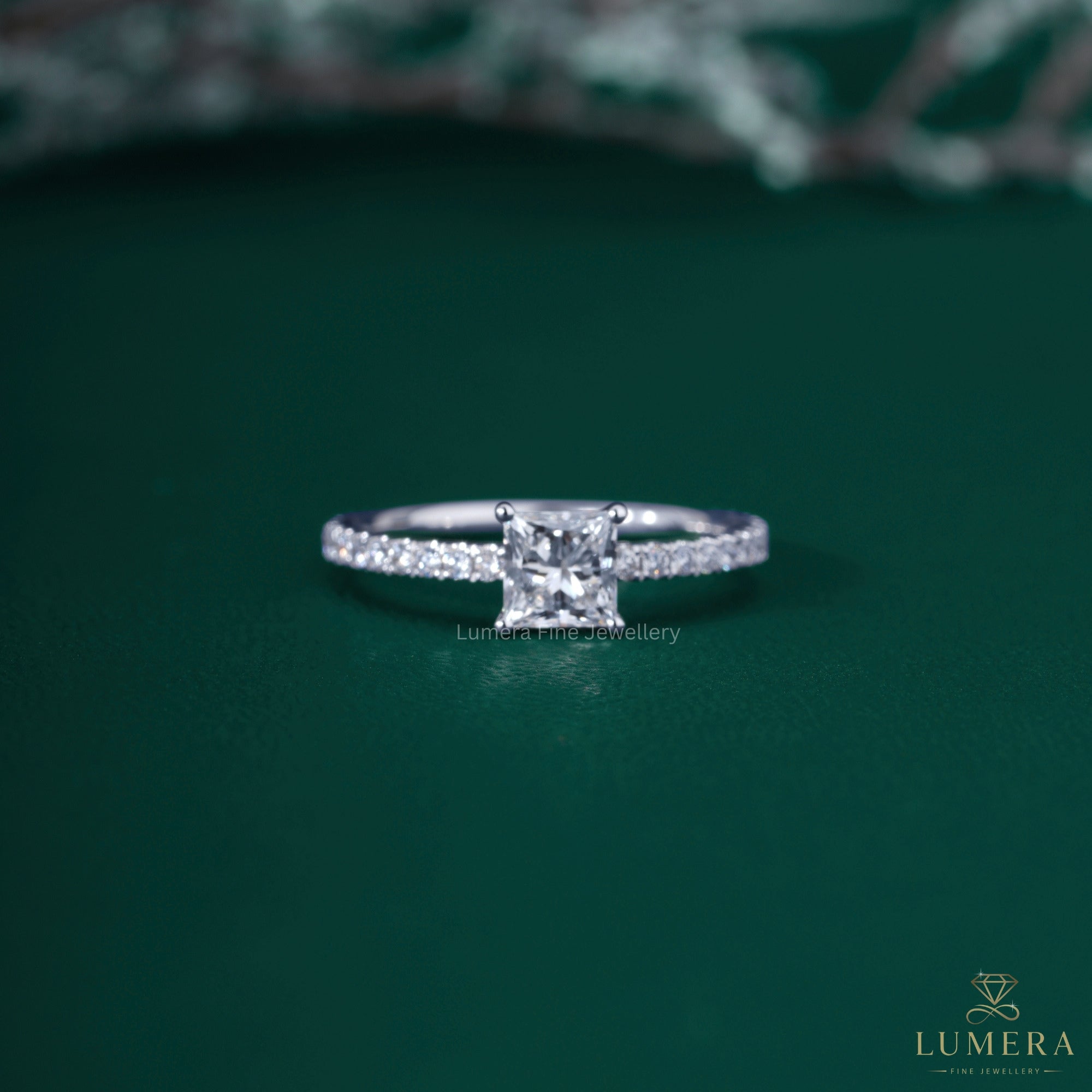 Princess diamond engagement ring with basket setting ring.