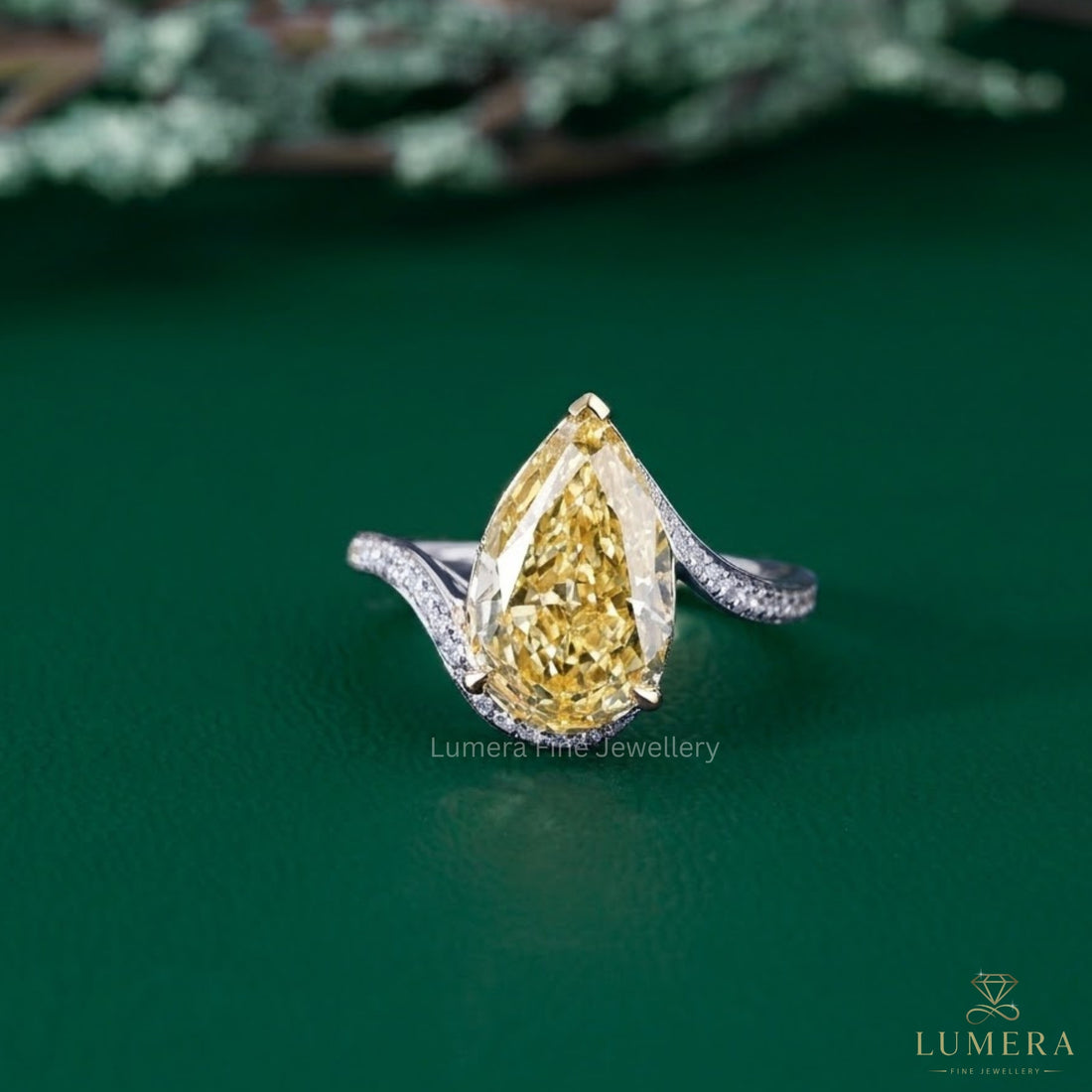 pear shaped yellow diamond ring with bypass pave engagement ring.