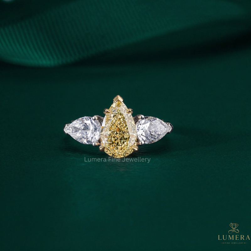 yellow diamond ring with yellow pear diamond ring.
