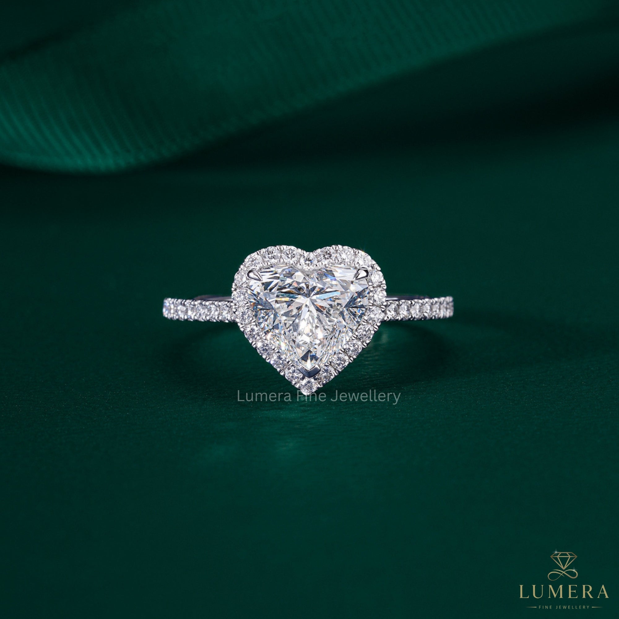 heart shaped diamond engagement ring with cathedral setting ring.

