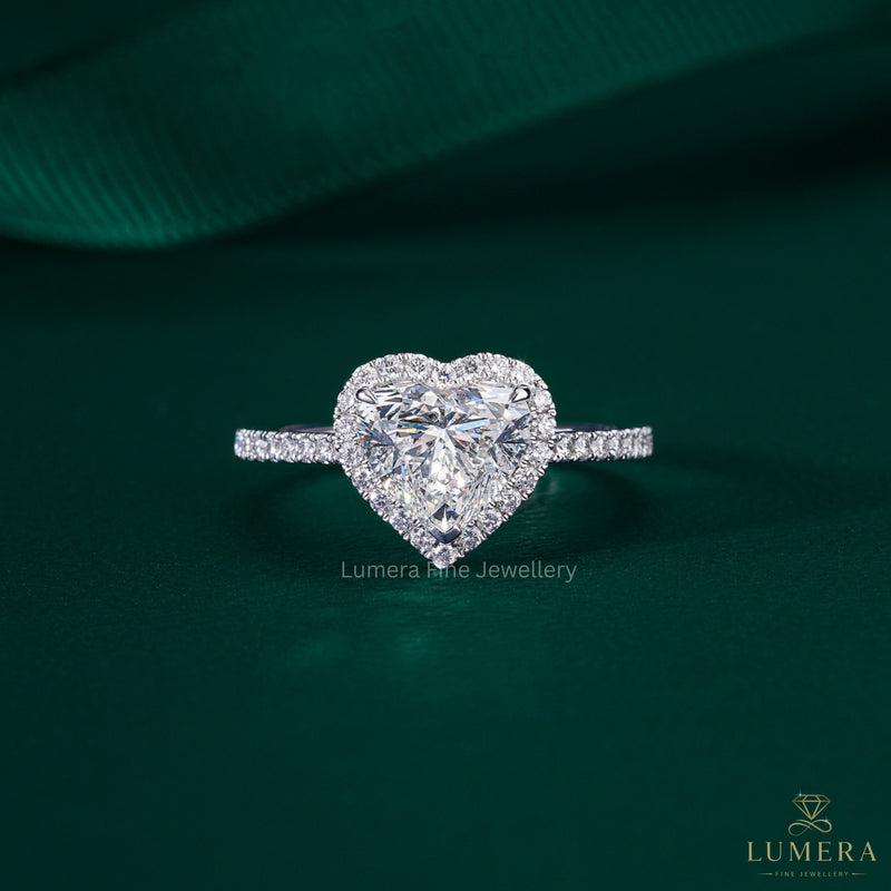 heart shaped diamond engagement ring with cathedral setting ring.
