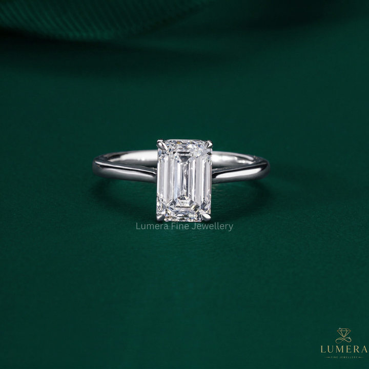 emerald cut engagement ring with emerald solitaire ring.
