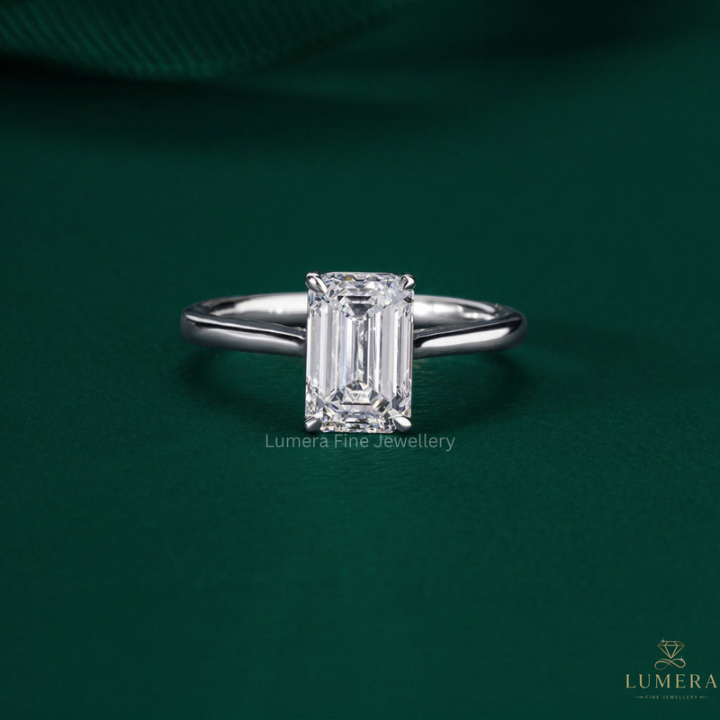 emerald cut engagement ring with emerald solitaire ring.
