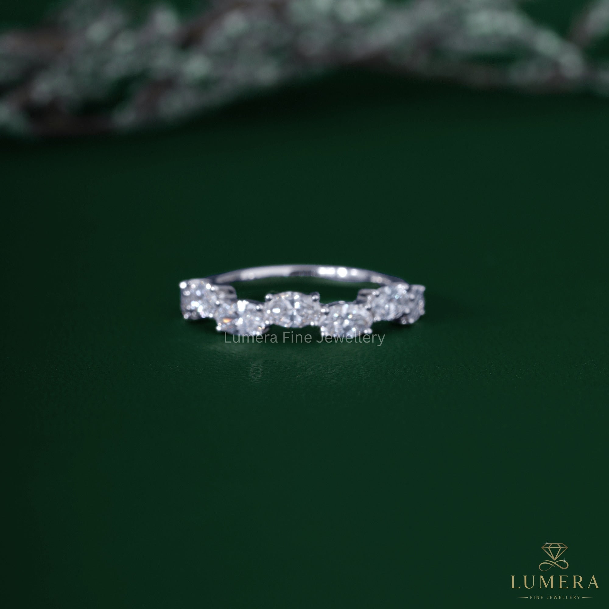 Oval diamond wedding band with zig zag diamond band.