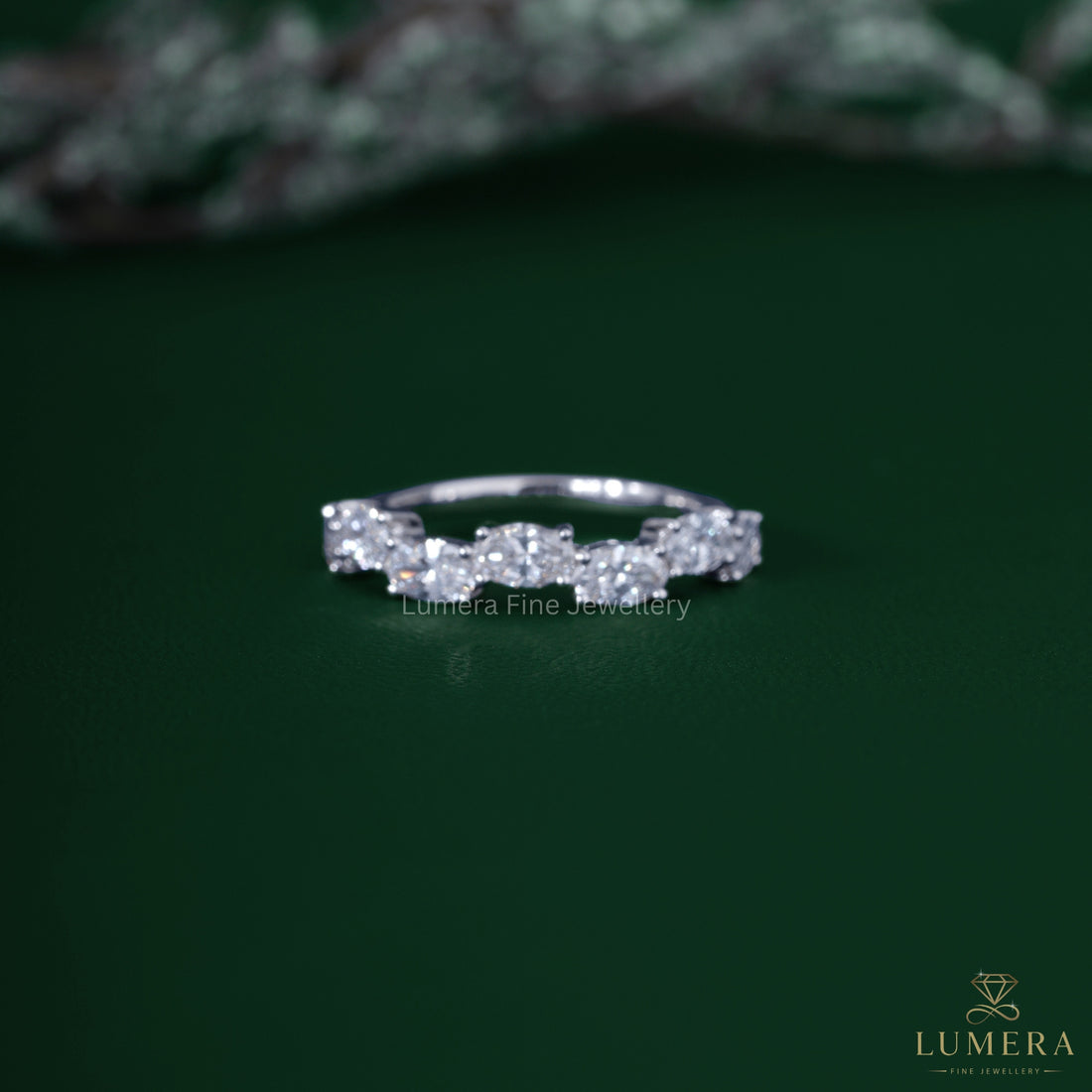 Oval diamond wedding band with zig zag diamond band.