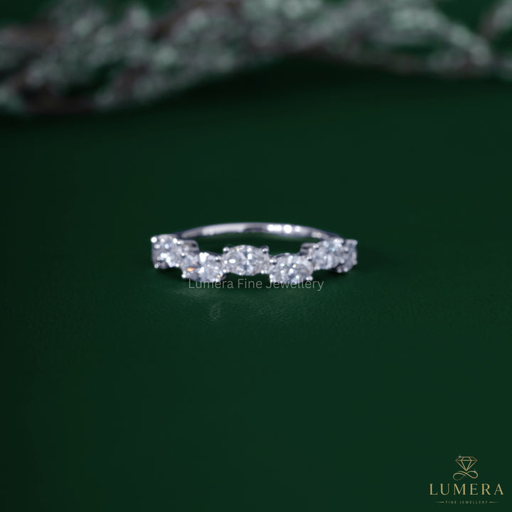 Oval diamond wedding band with zig zag diamond band.