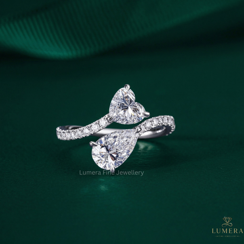 toi et moi engagement ring with heart shaped ring.
