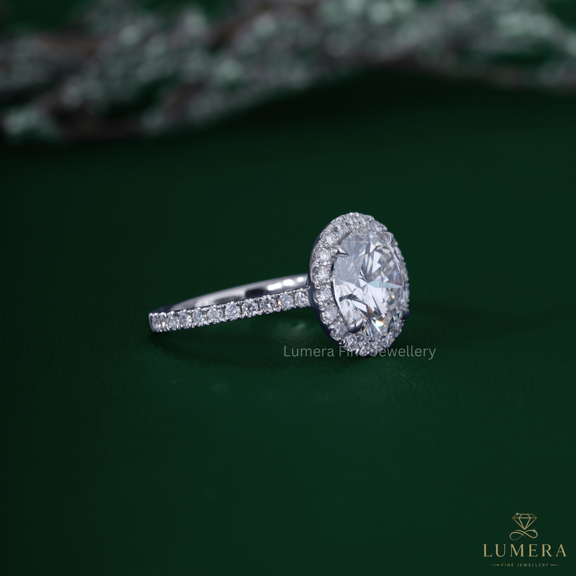 Round cut engagement ring with 4 prong engagement ring.