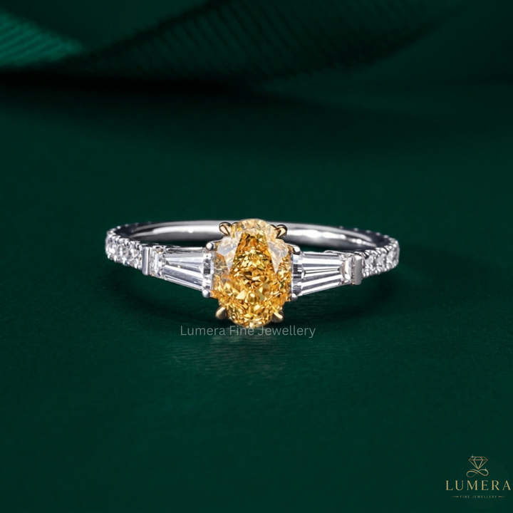 Yellow Diamond Three Stone Ring with oval diamond engagement ring.