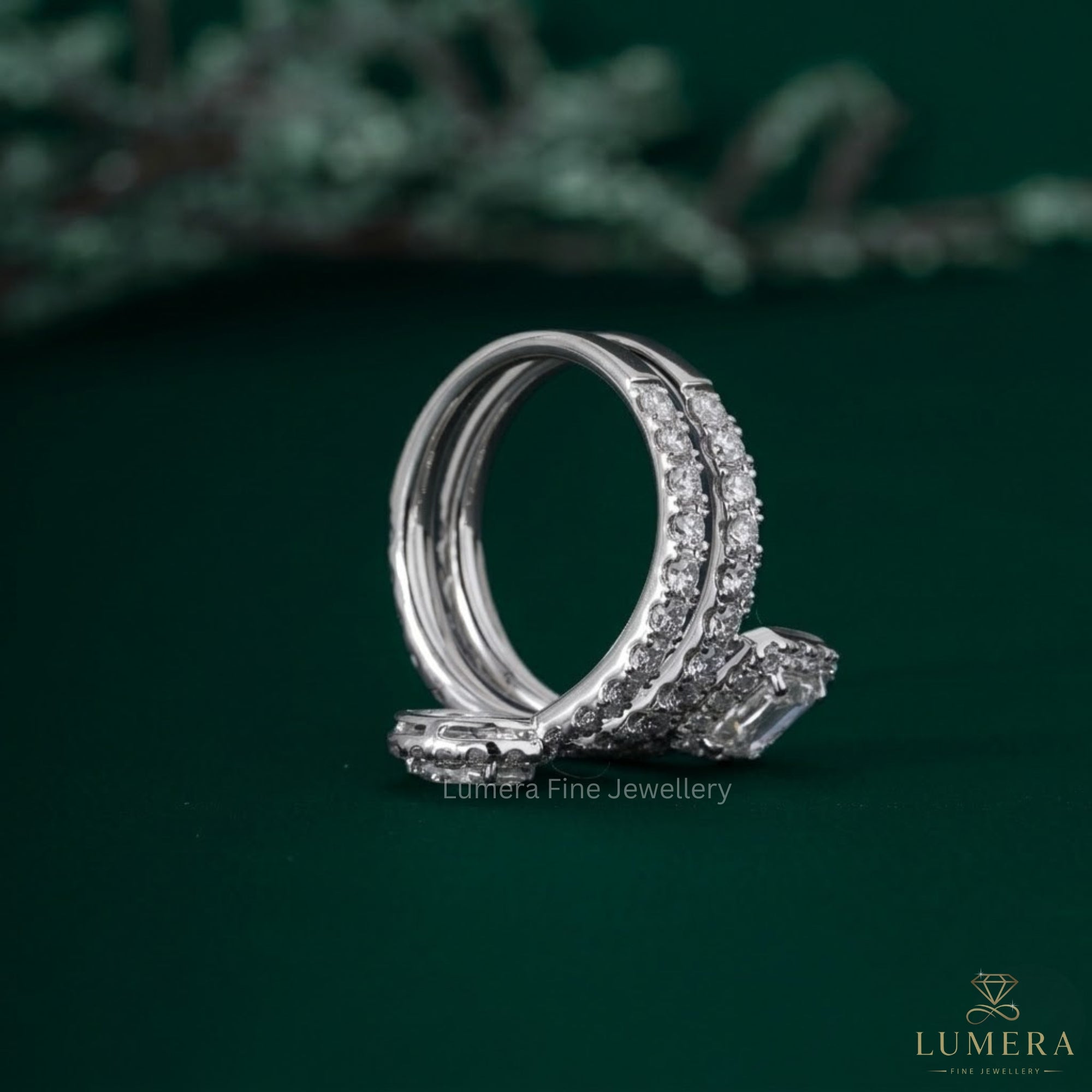Oval and emerald wedding band with pave diamond band.