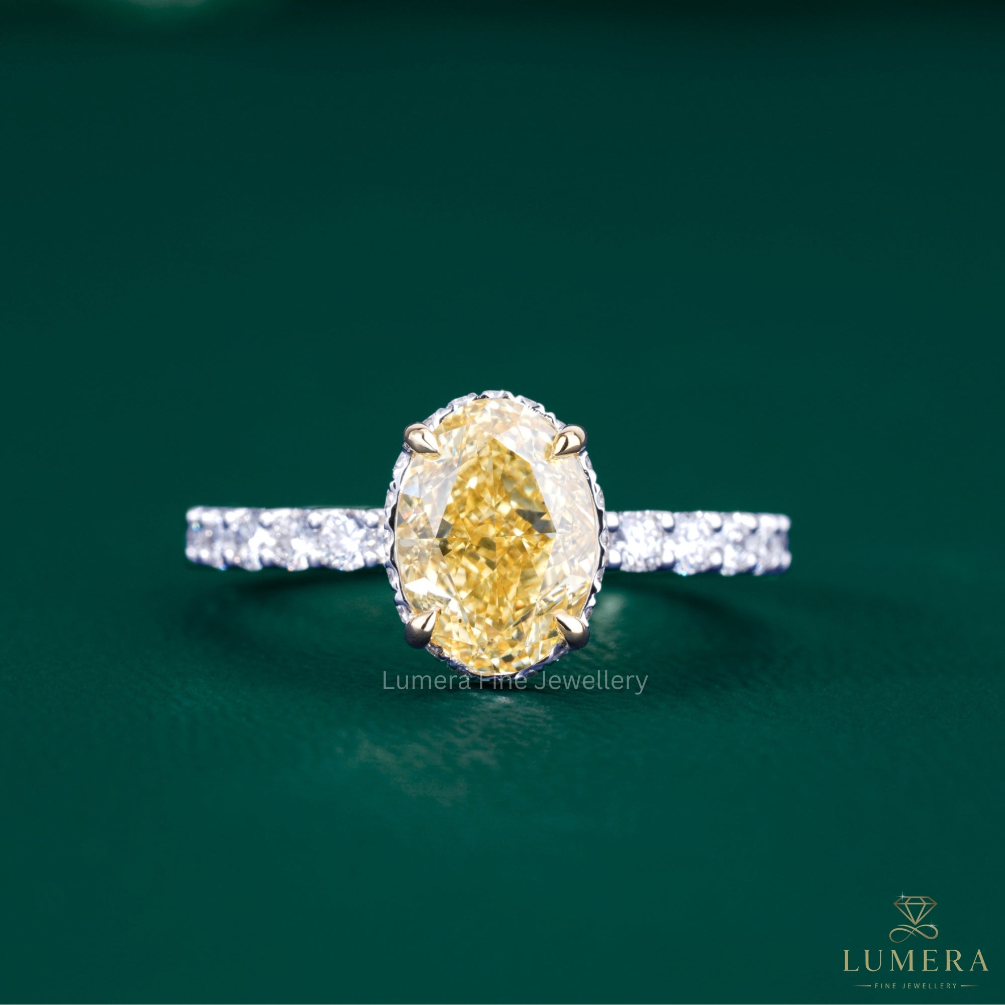 oval yellow diamond ring with two tone gold ring.