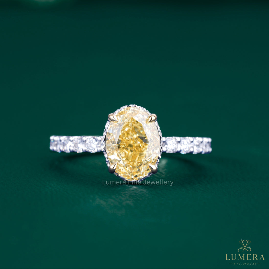 oval yellow diamond ring with two tone gold ring.