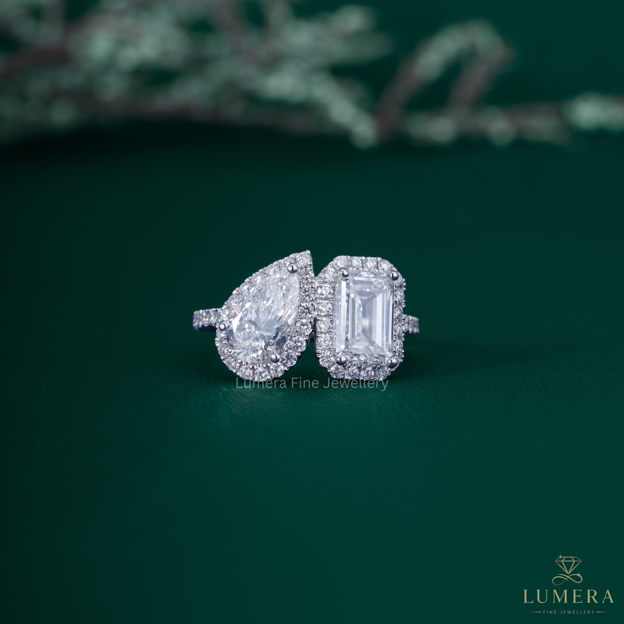 Pear and emerald diamond ring with pear diamond ring.