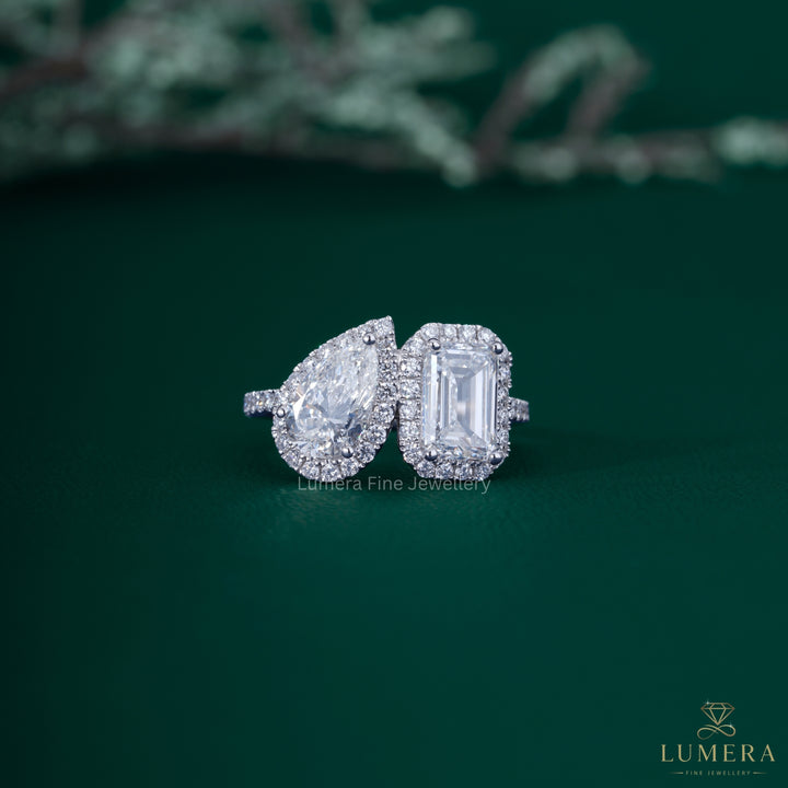 Pear and emerald diamond ring with pear diamond ring.