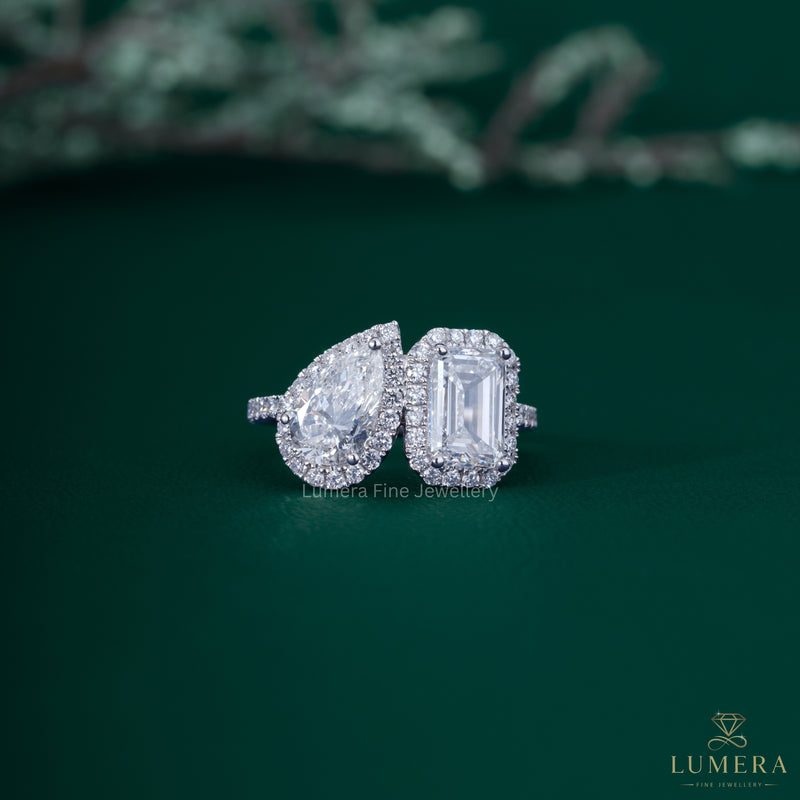 Pear and emerald diamond ring with pear diamond ring.
