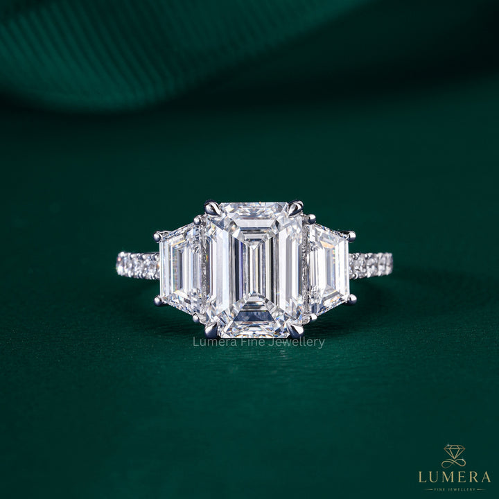 trilliogy ring with emerald three stone ring.