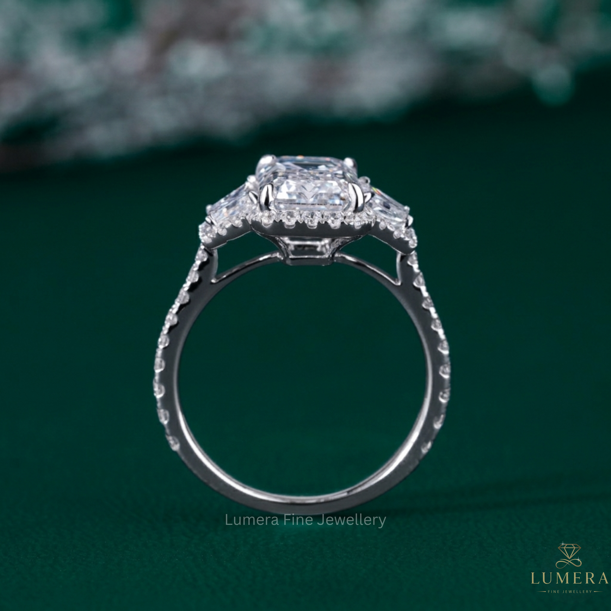 emerald three stone engagement ring with three stone diamond ring.
