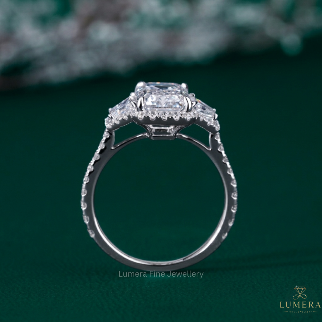 emerald three stone engagement ring with three stone diamond ring.