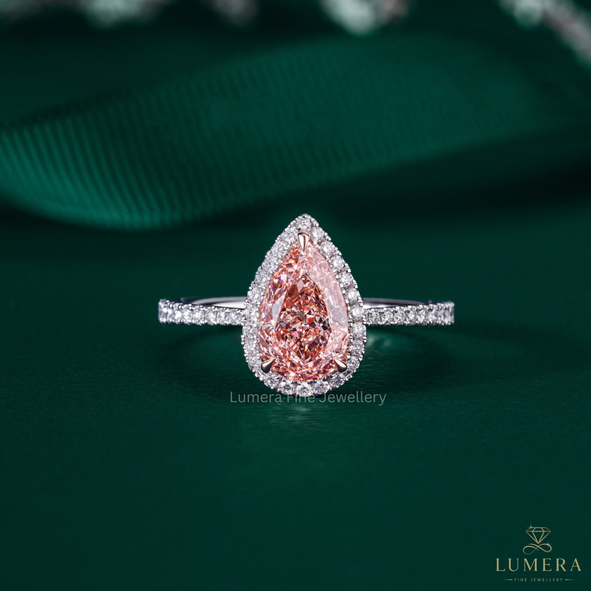 pear shape engagement ring with halo ring setting.
