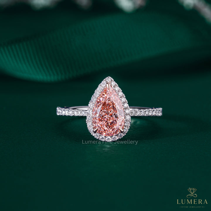 pear shape engagement ring with halo ring setting.
