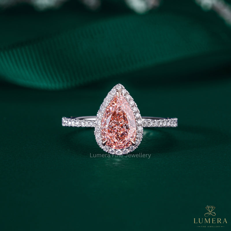 pear shape engagement ring with halo ring setting.
