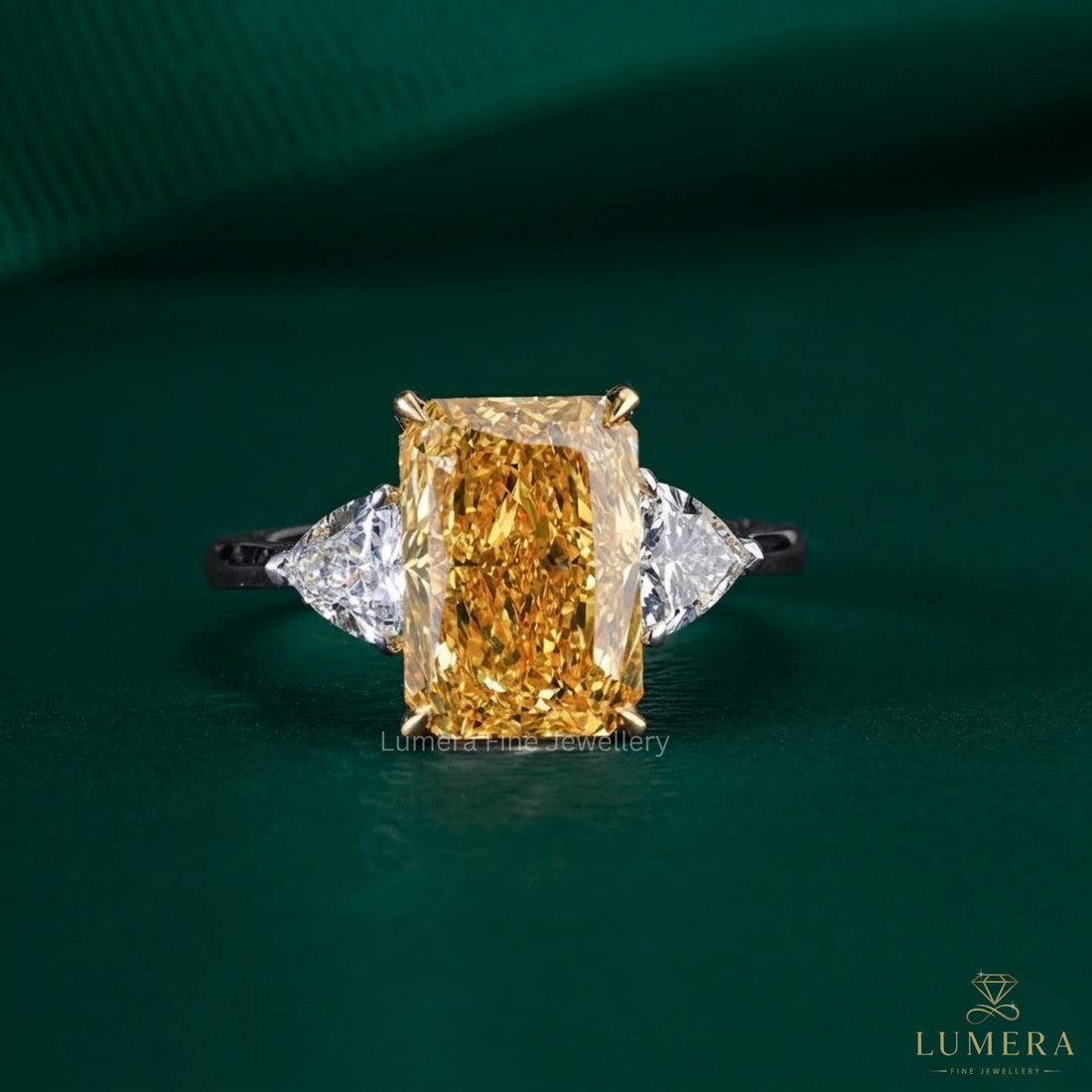 radiant engagement ring with trillion side stone.
