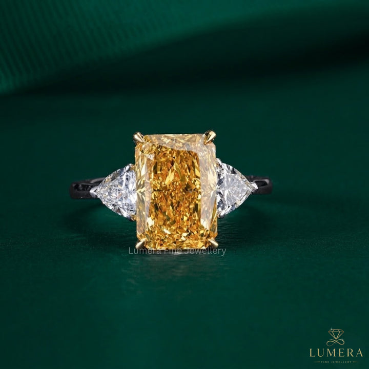 radiant engagement ring with trillion side stone.
