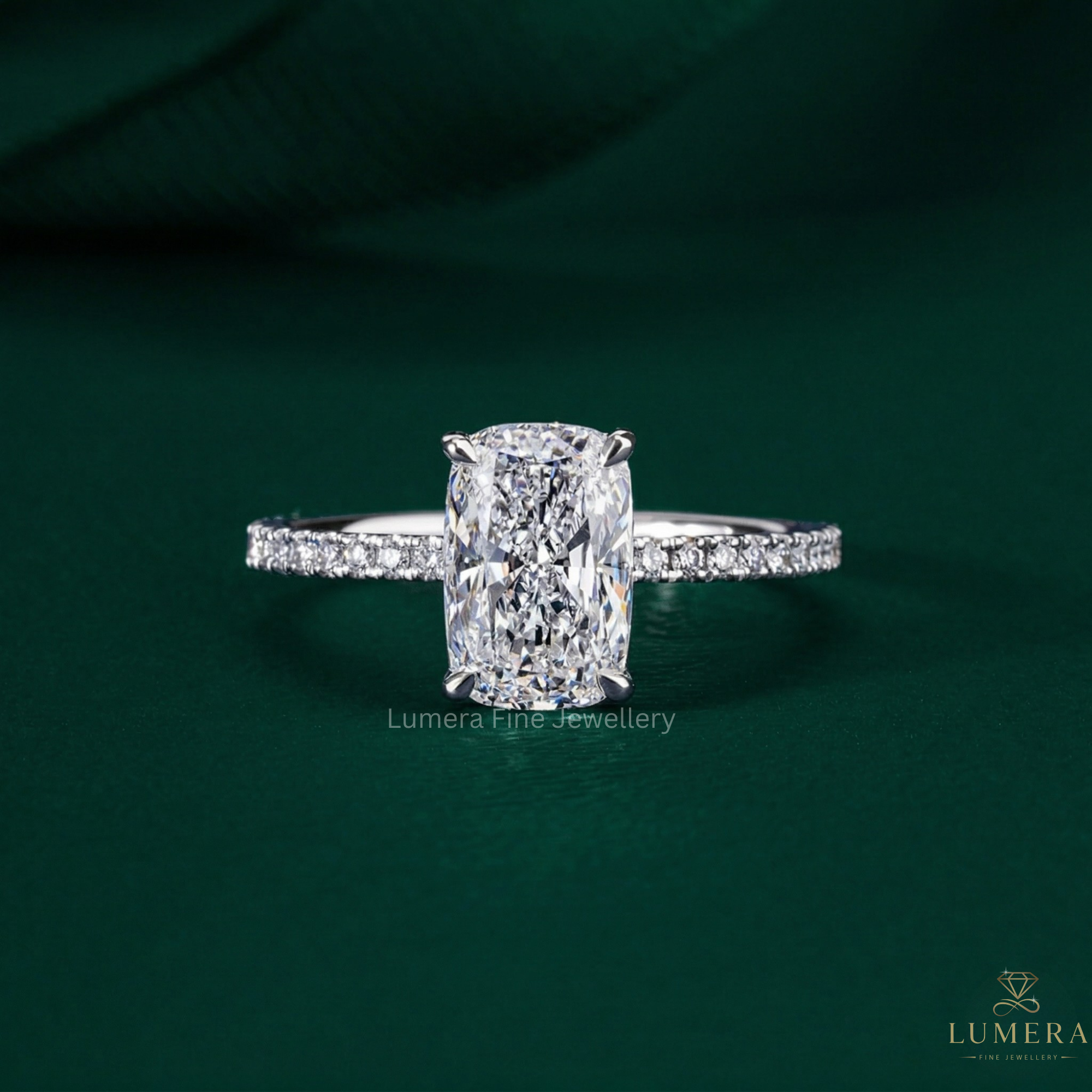 elongated cushion cut engagement ring with hidden halo ring.