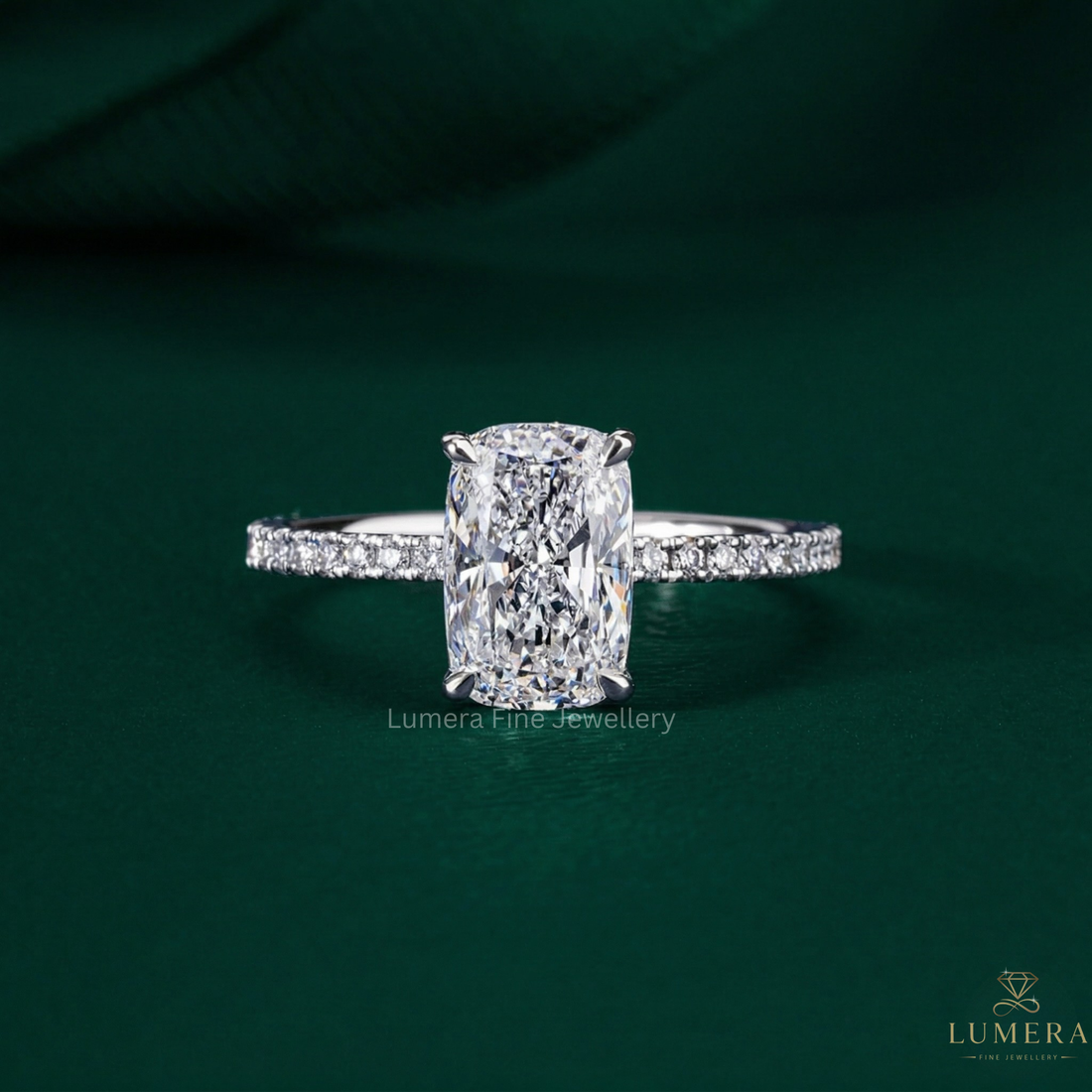 elongated cushion cut engagement ring with hidden halo ring.
