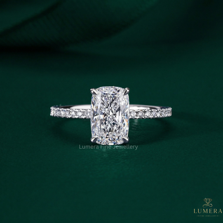 elongated cushion cut engagement ring with hidden halo ring.