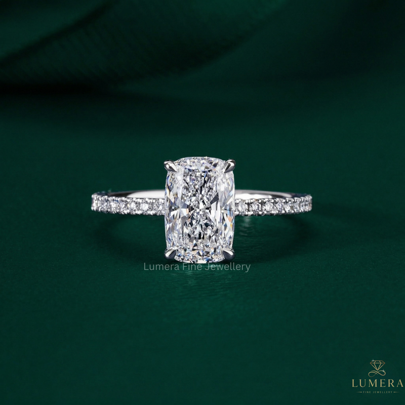 elongated cushion cut engagement ring with hidden halo ring.