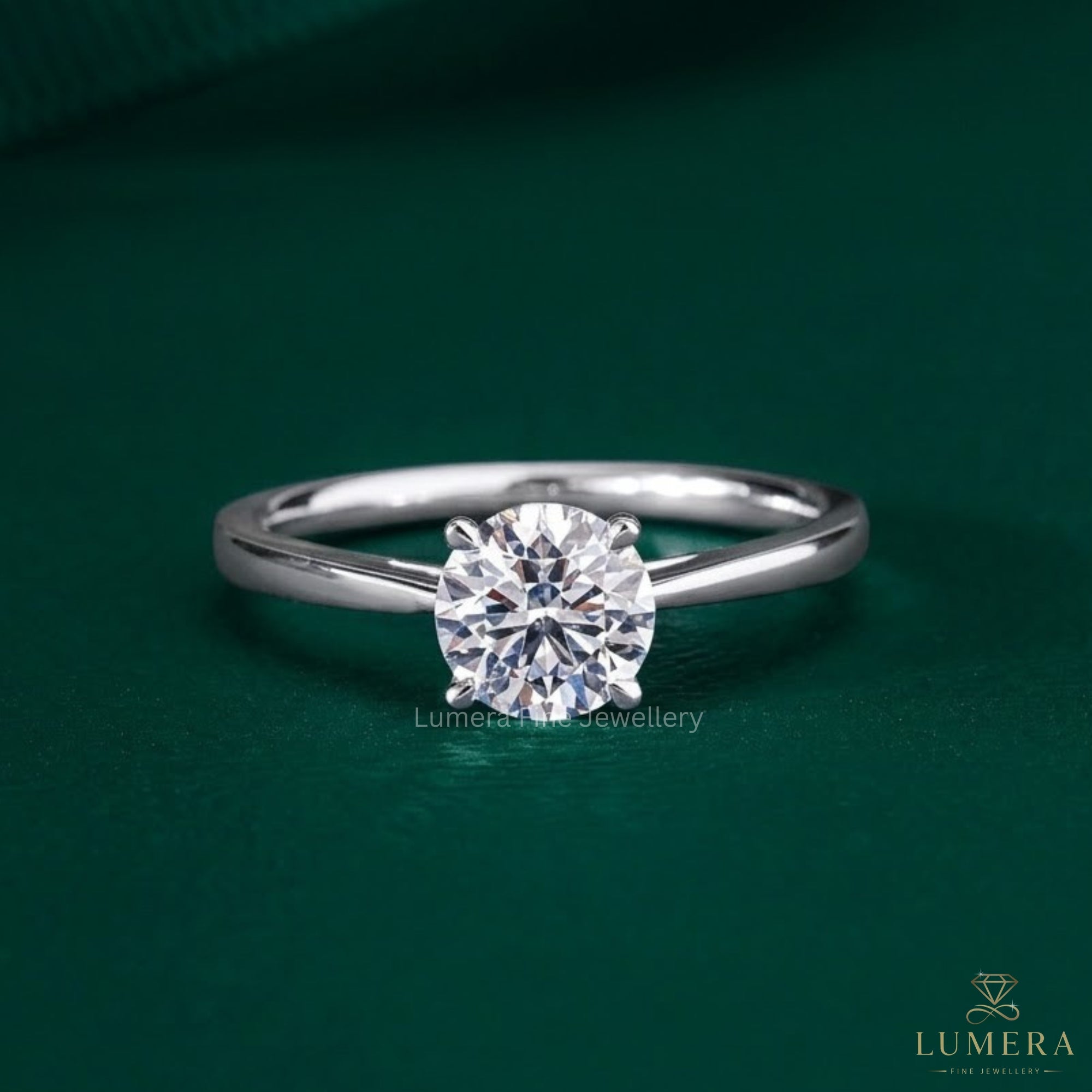 round diamond engagement ring with claw prong setting.