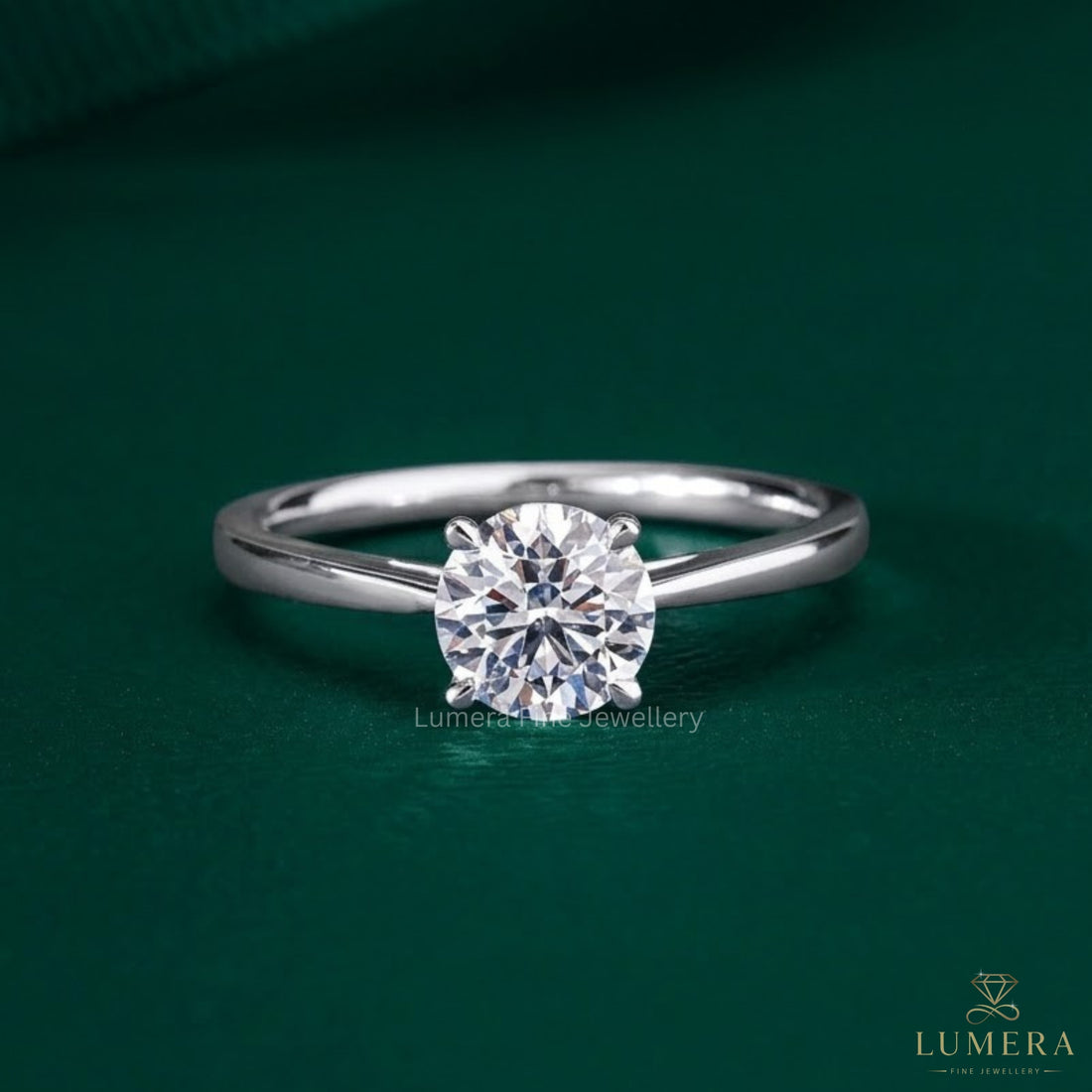 round diamond engagement ring with claw prong setting.